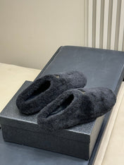PRADA 25S CLOGS IN BLACK SHEARLING