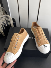 CHANEL 26S LOW TOP BEIGE IN NAVY BLUE CANVAS
