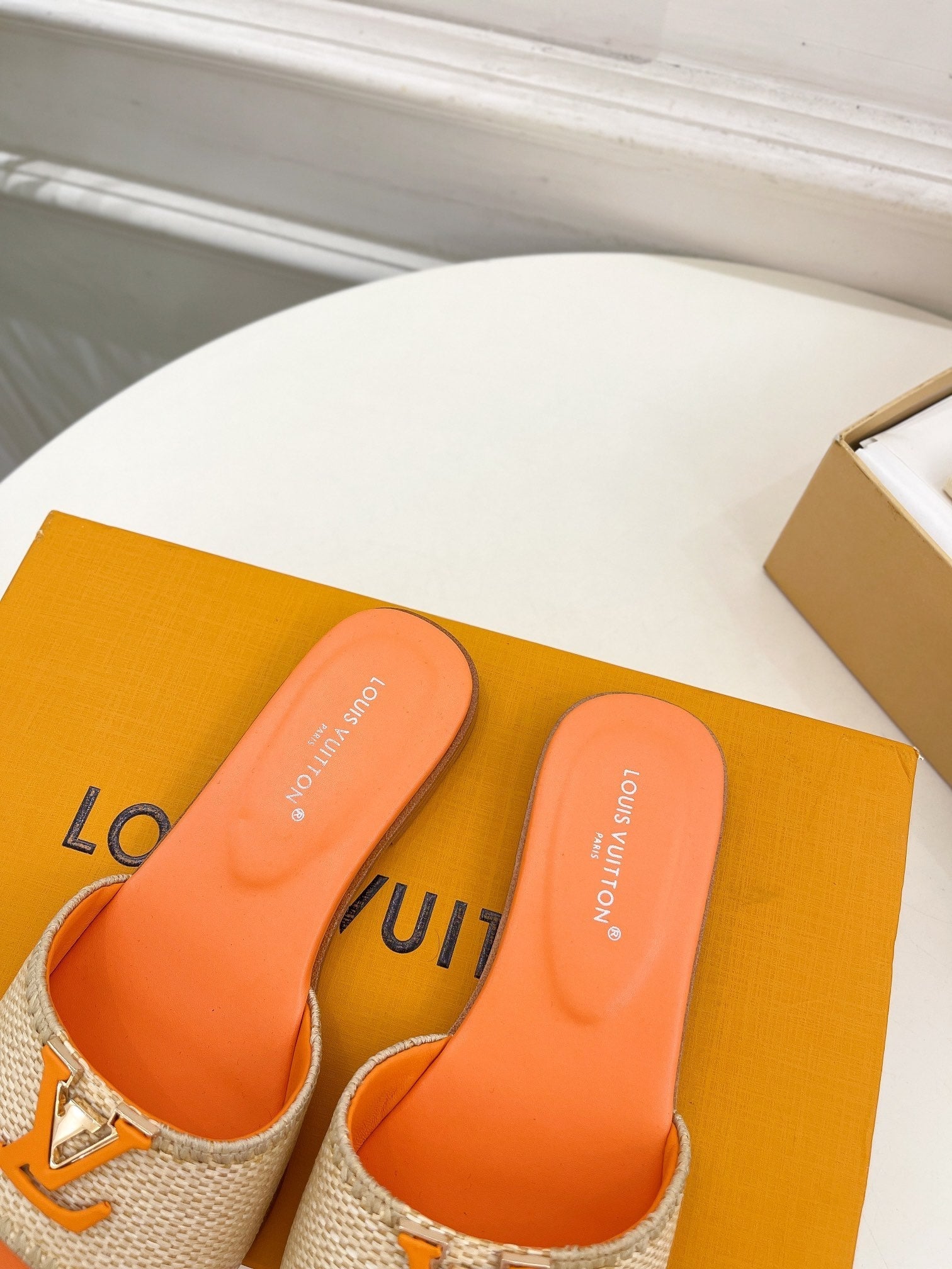LV WOMEN CAPRI FLAT MULES IN TIGER ORANGE LEATHER AND RAFFIA