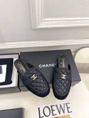 CHANEL 26S MULES IN BLACK LAMBSKIN AND TWEED